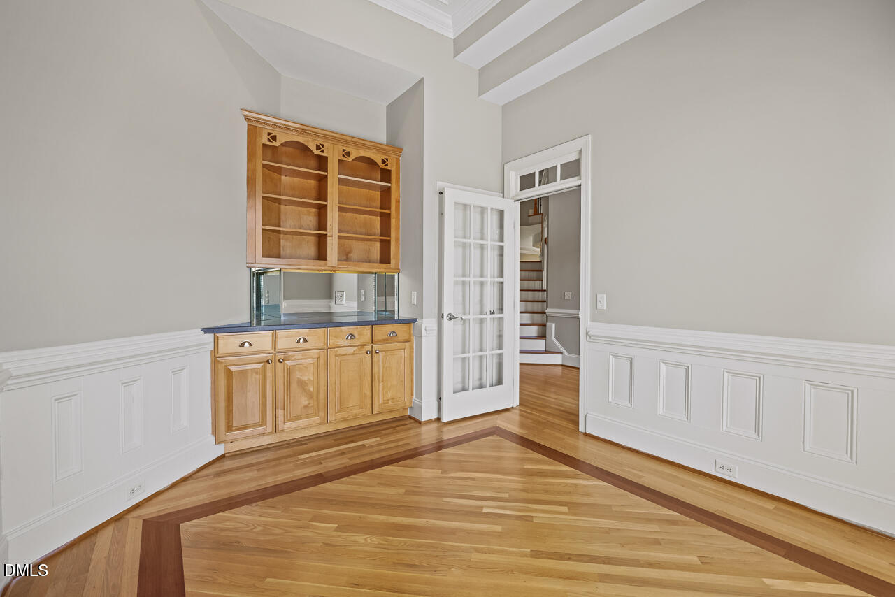 4004 Frontenac Court Apex, NC 27539 - Photo 9 of 61 a view of empty room with wooden floor and window