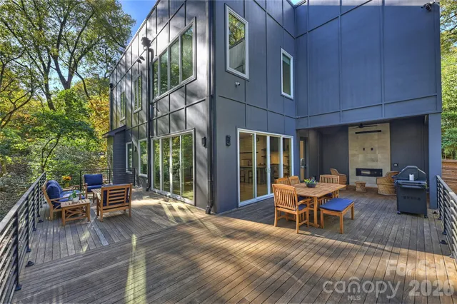 a view of a patio with a table and chairs in the patio