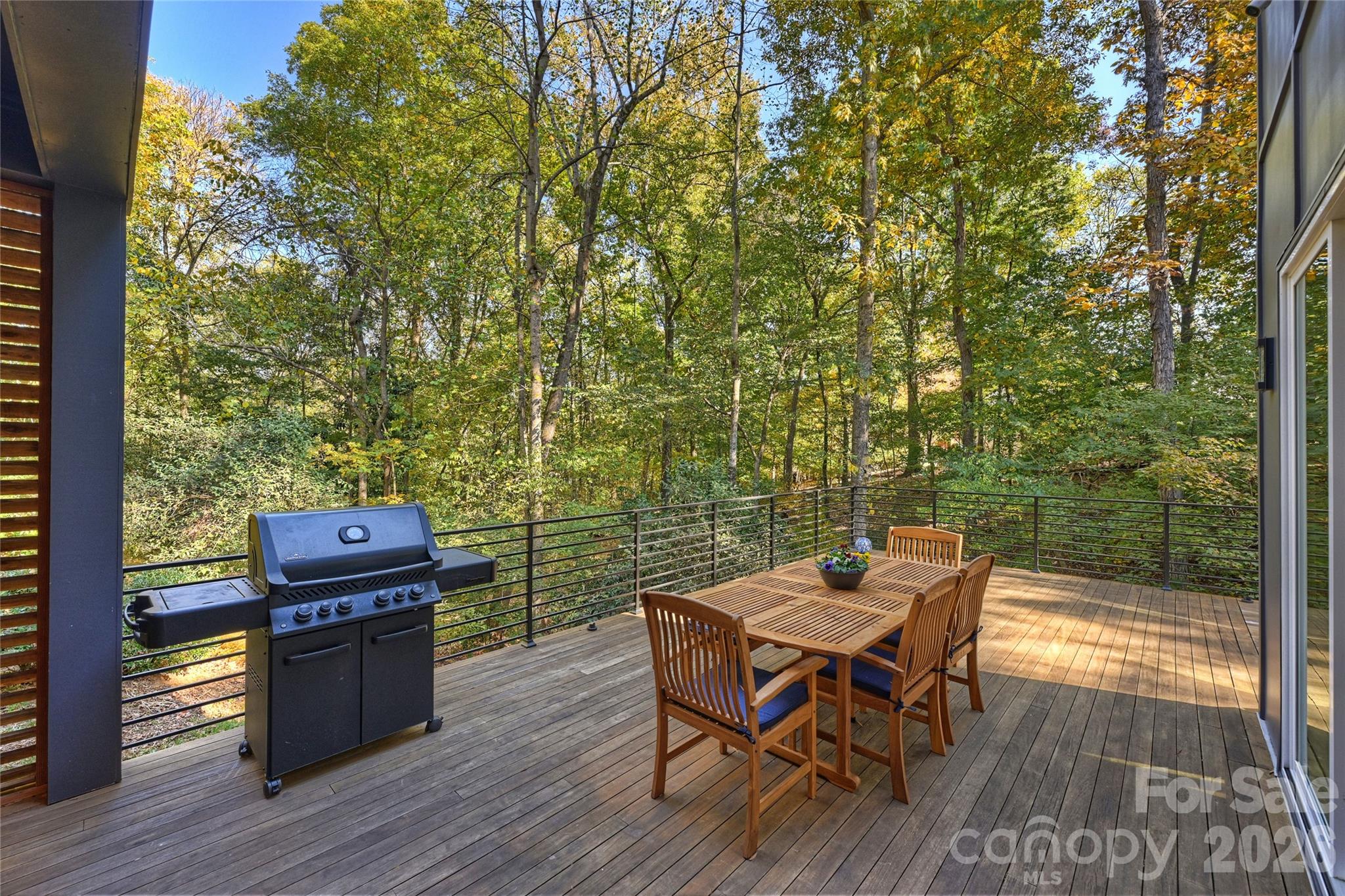 7223 Terrace Drive Charlotte, NC 28211 - Photo 20 of 48 an outdoor sitting area with couch and wooden floor