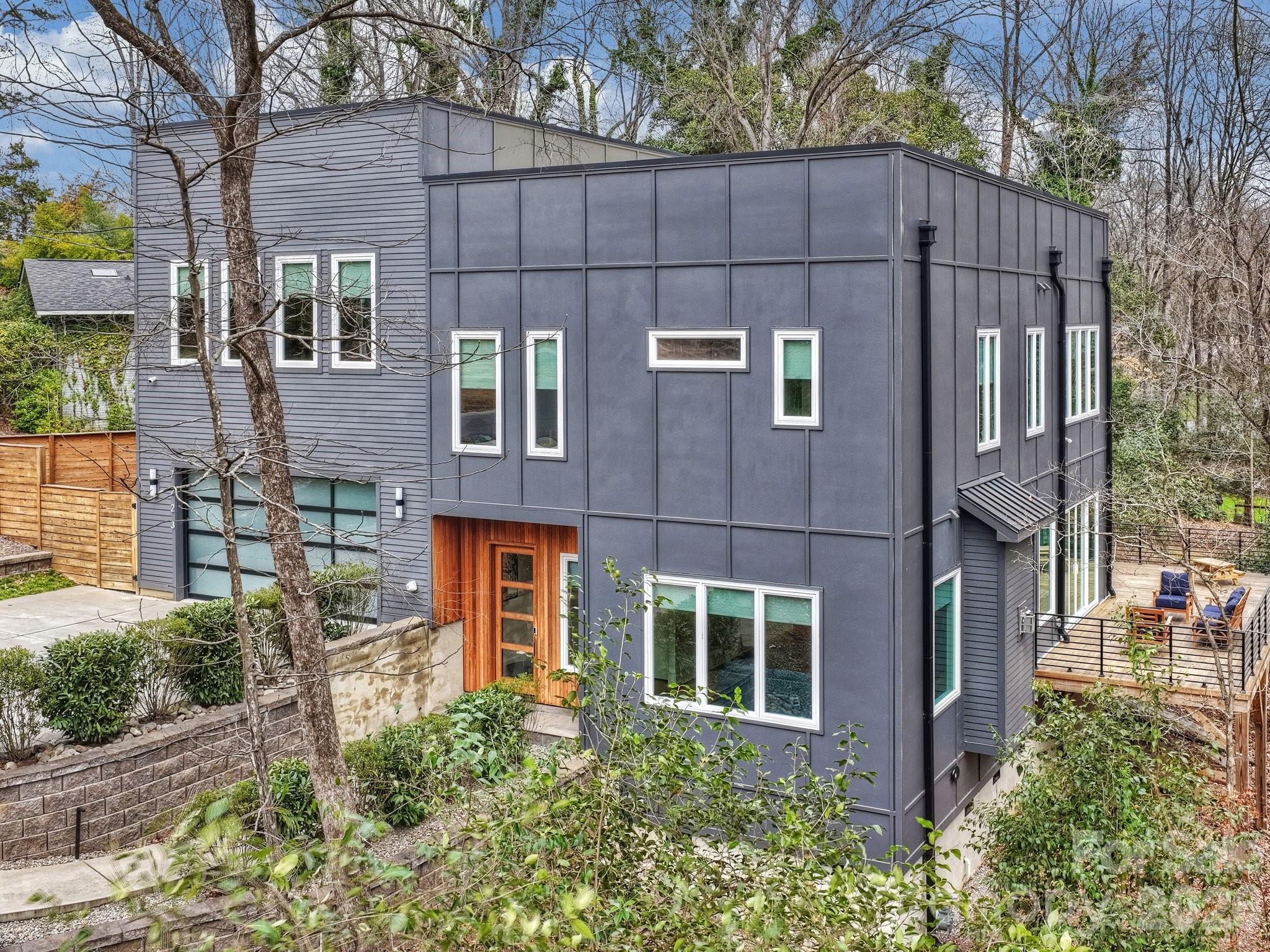 7223 Terrace Drive Charlotte, NC 28211 - Photo 2 of 45 a view of a blue building next to a yard