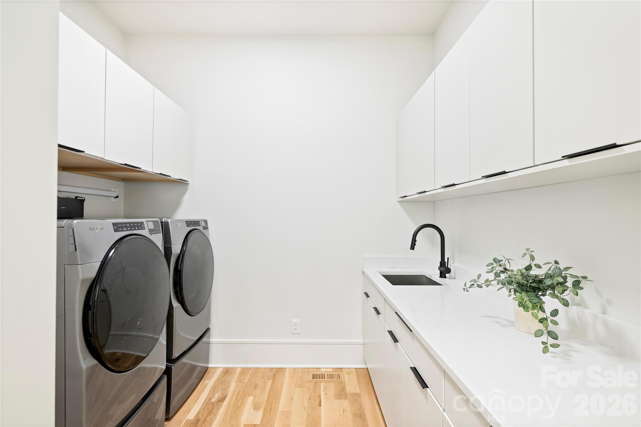 7223 Terrace Drive Charlotte, NC 28211 - Photo 22 of 48 a bathroom with a sink and mirror
