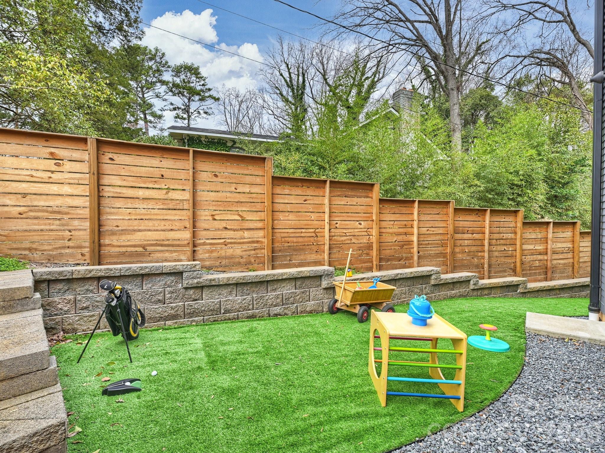 7223 Terrace Drive Charlotte, NC 28211 - Photo 23 of 45 a front view of a house with backyard and sitting area