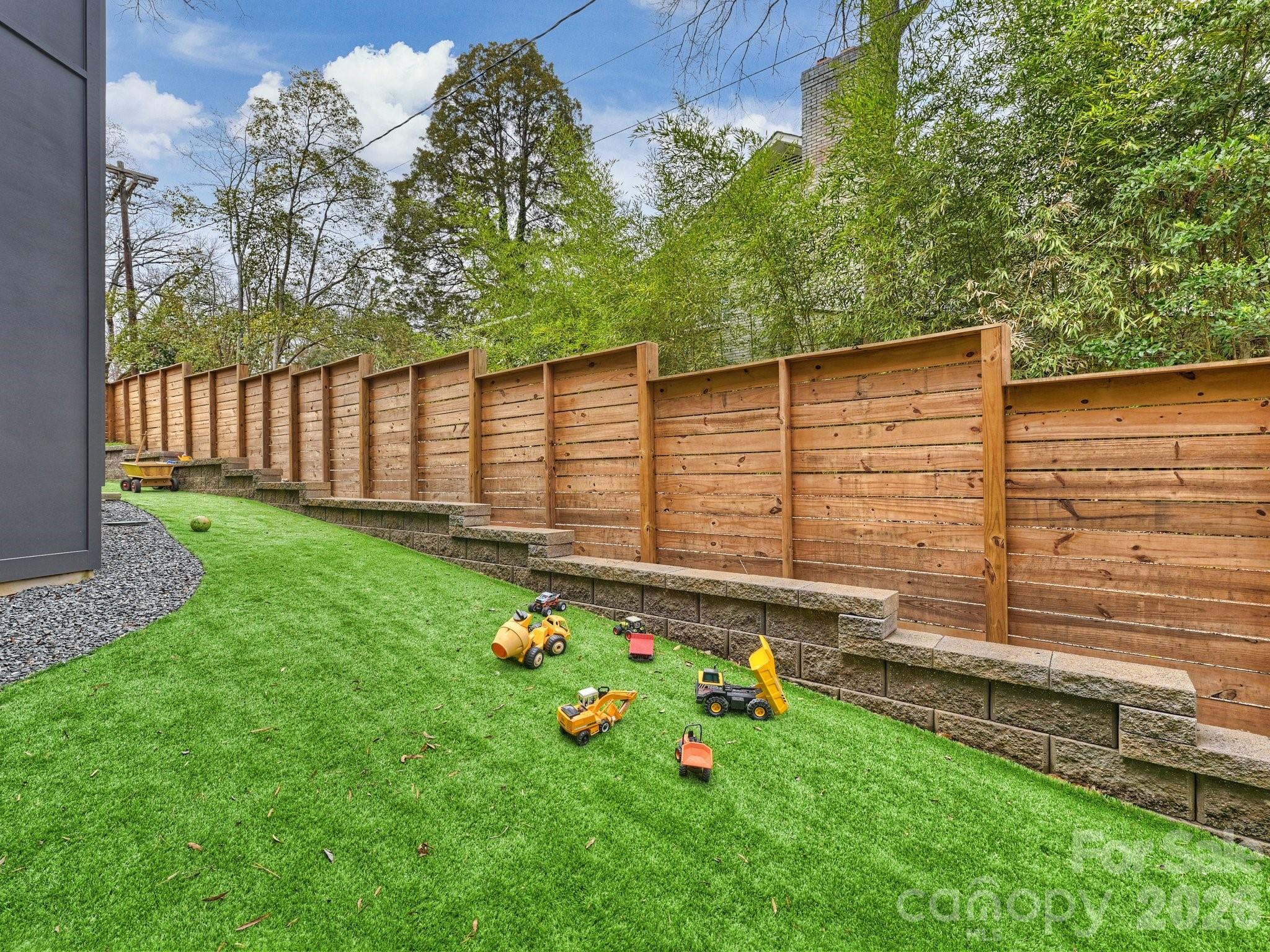 7223 Terrace Drive Charlotte, NC 28211 - Photo 24 of 45 a view of a backyard with a tree