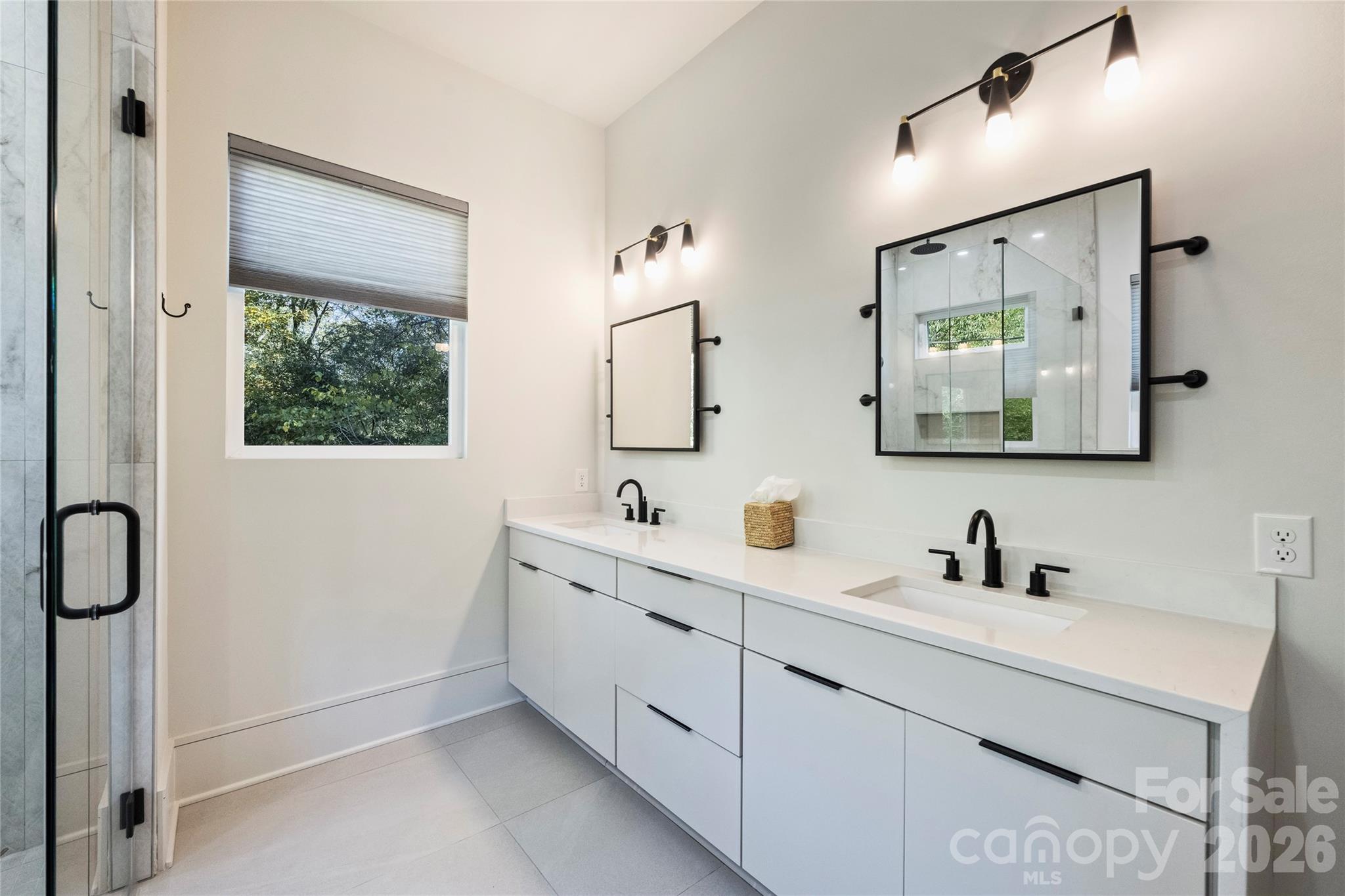 7223 Terrace Drive Charlotte, NC 28211 - Photo 27 of 48 a bathroom with a double vanity sink mirror and a