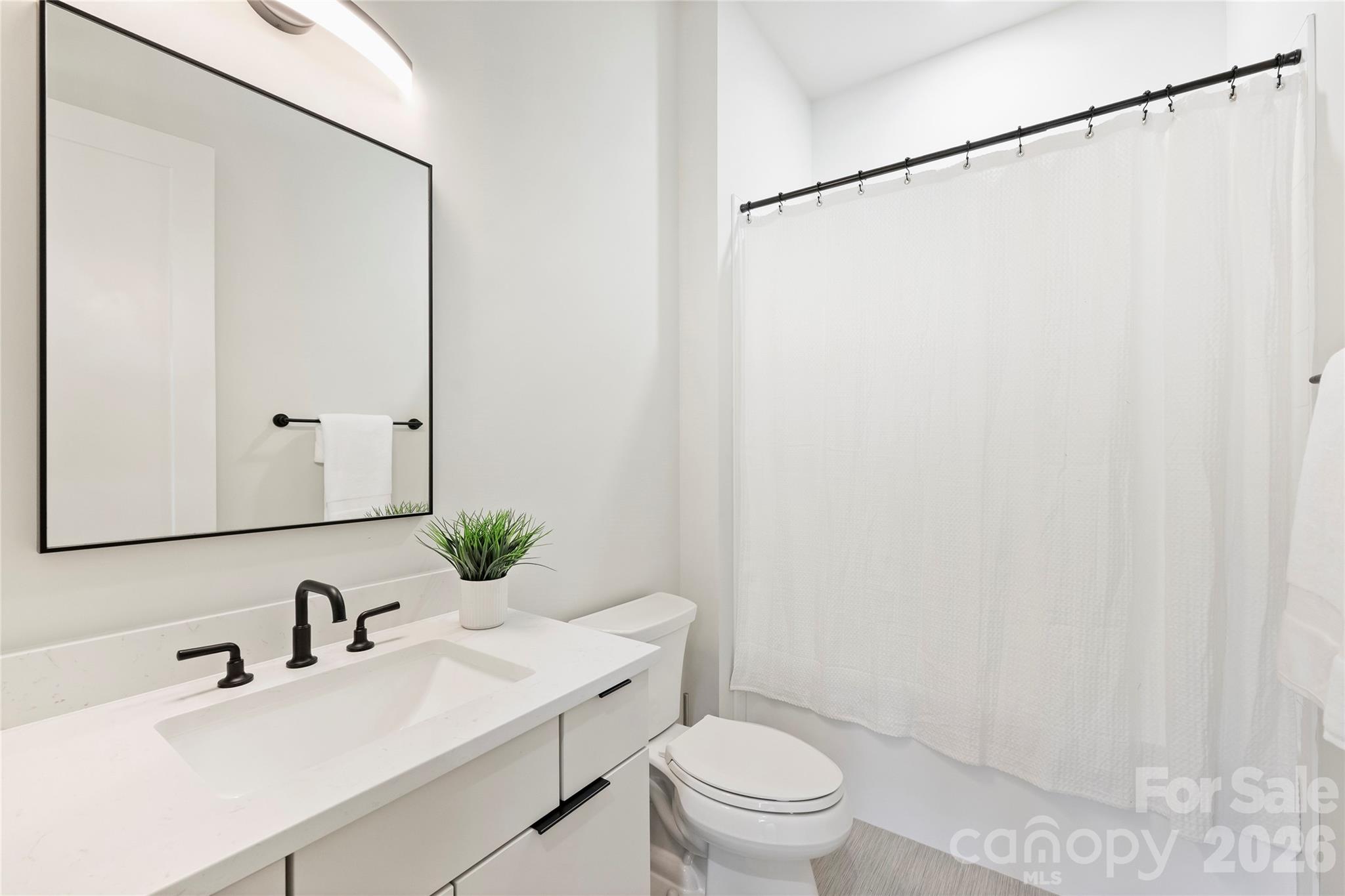 7223 Terrace Drive Charlotte, NC 28211 - Photo 31 of 48 a bathroom with a sink toilet and shower