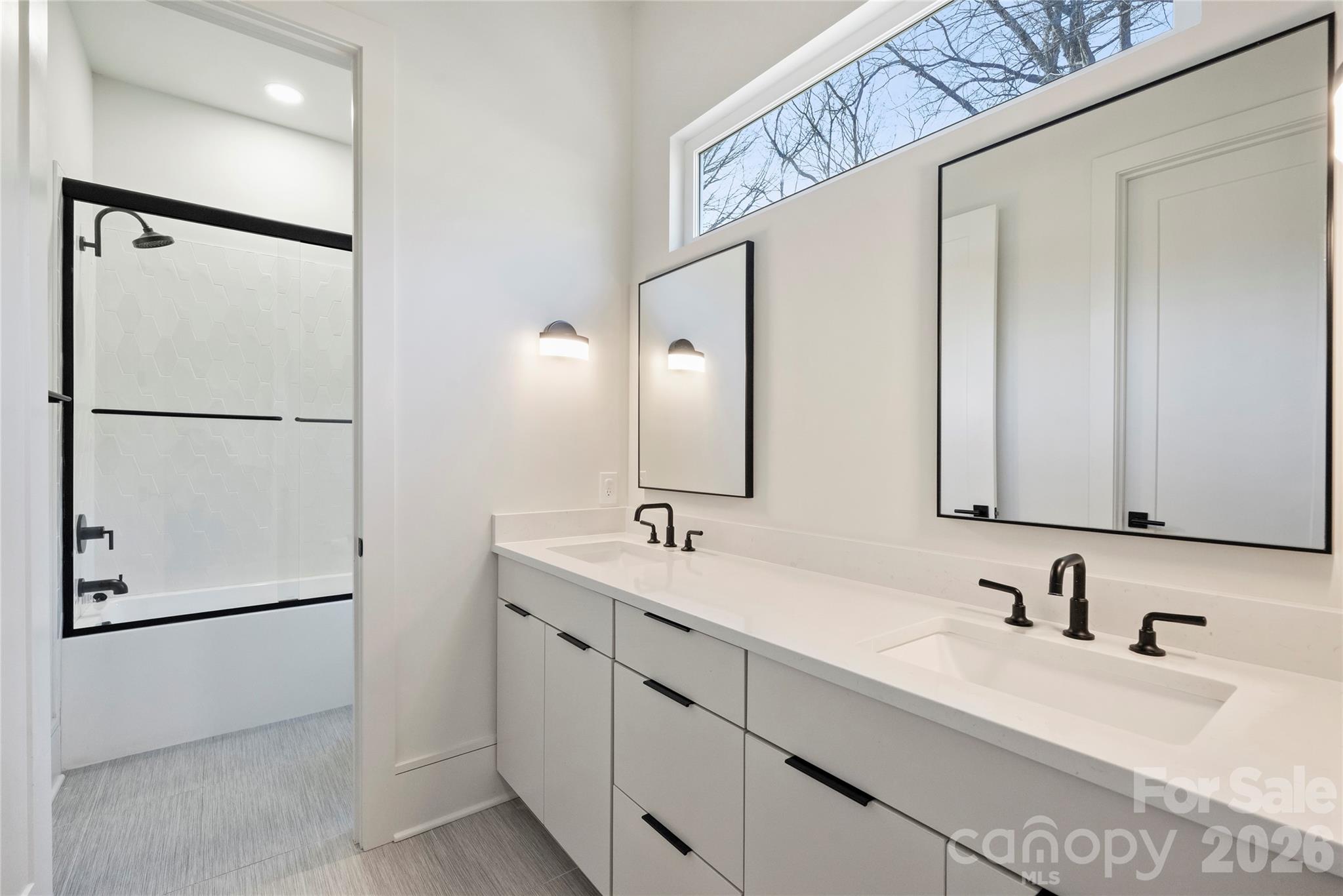 7223 Terrace Drive Charlotte, NC 28211 - Photo 32 of 45 a bathroom with a double vanity sink and mirror