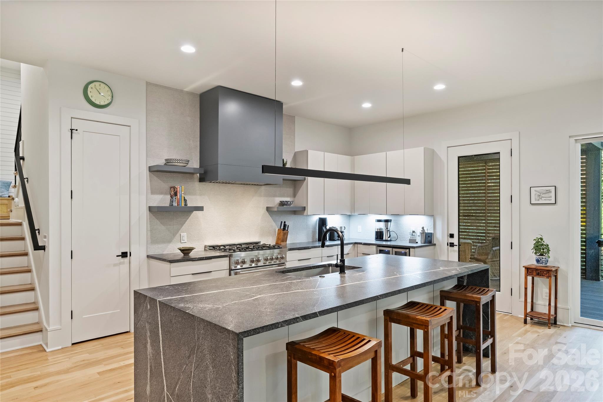 7223 Terrace Drive Charlotte, NC 28211 - Photo 5 of 45 a kitchen with kitchen island granite countertop a sink a counter space and stainless steel appliances