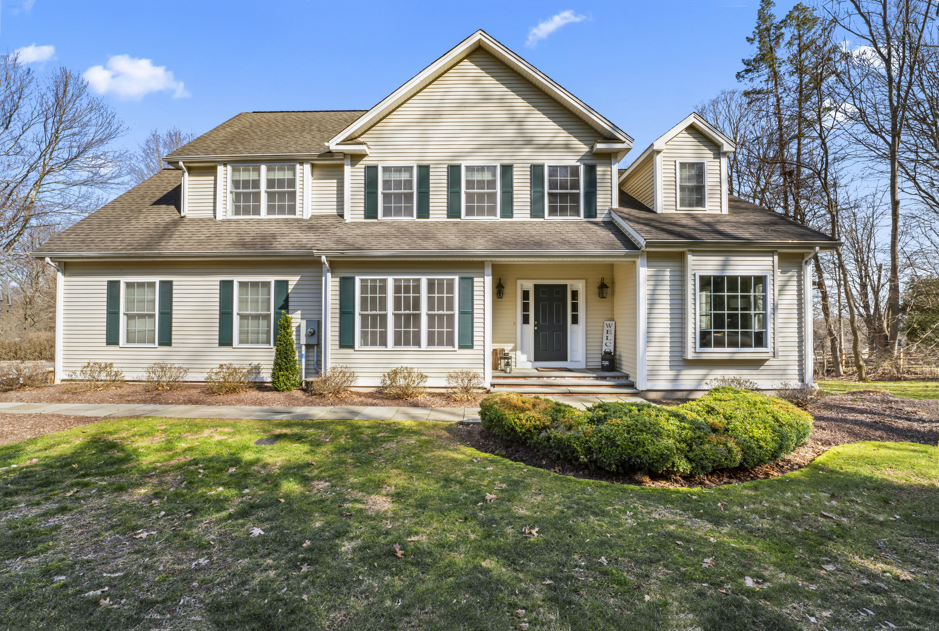 front view of a house with a yard