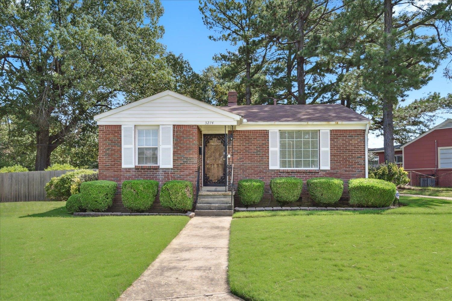 3274 Norton Road Memphis, TN 38109 - Photo 1 of 26 a front view of a house with a yard