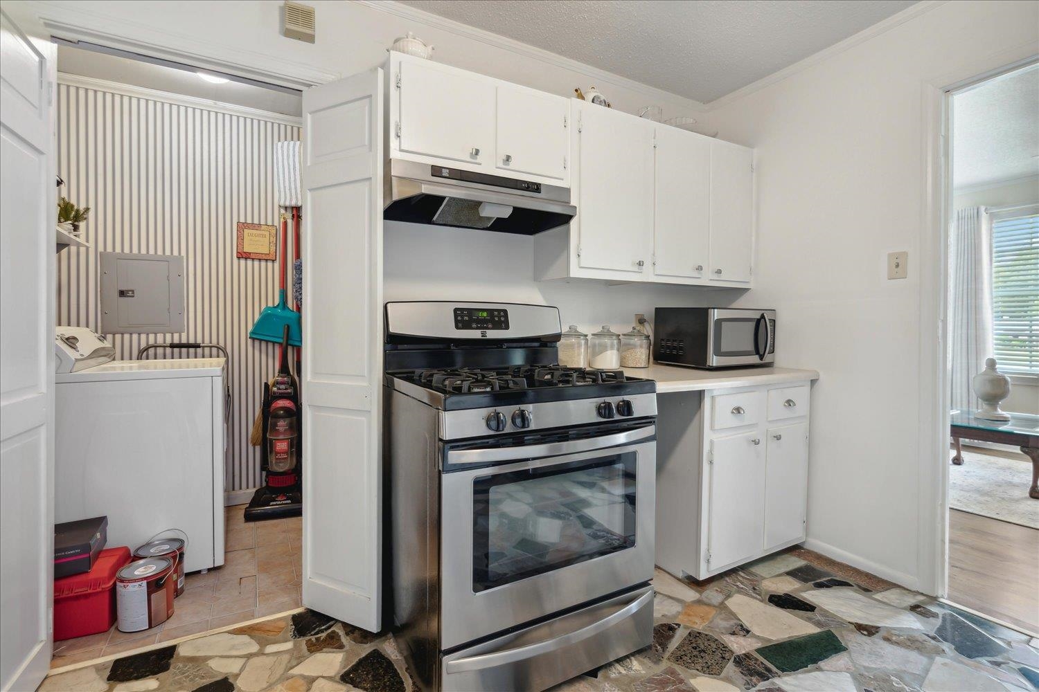 3274 Norton Road Memphis, TN 38109 - Photo 11 of 26 a kitchen with stainless steel appliances a stove a refrigerator and cabinets