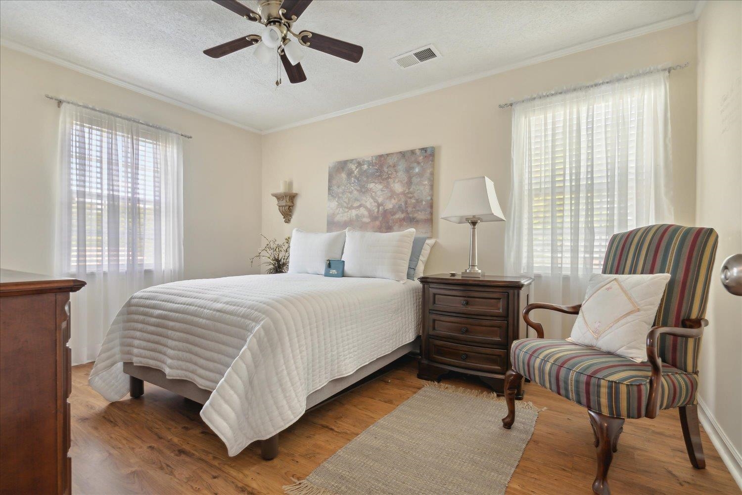 3274 Norton Road Memphis, TN 38109 - Photo 15 of 26 a bedroom with a bed and wooden floor