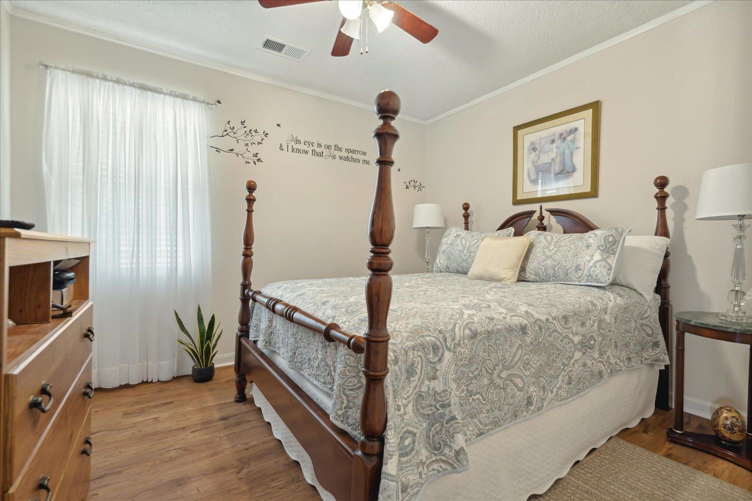 3274 Norton Road Memphis, TN 38109 - Photo 17 of 26 a bedroom with a bed and a flat tv screen on dresser