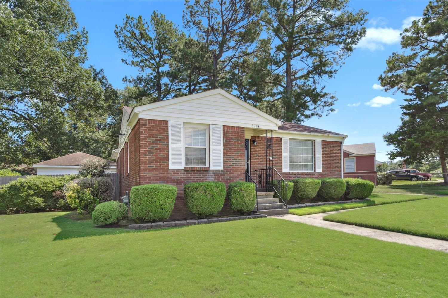 3274 Norton Road Memphis, TN 38109 - Photo 2 of 26 a front view of a house with a yard
