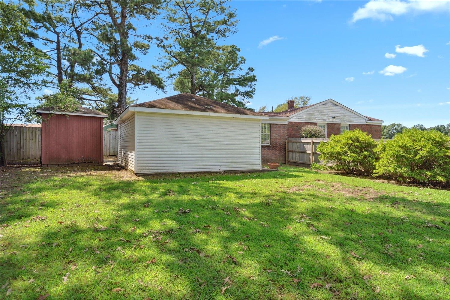 3274 Norton Road Memphis, TN 38109 - Photo 23 of 26 a view of a house with a yard and a large tree