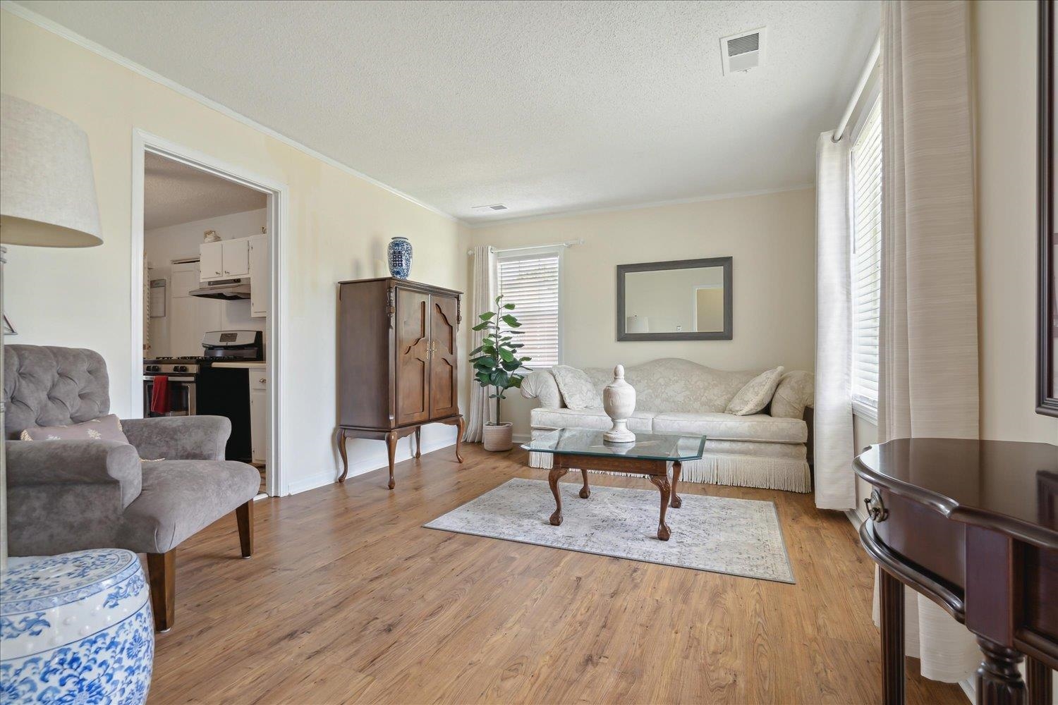 3274 Norton Road Memphis, TN 38109 - Photo 7 of 26 a living room with furniture and a wooden floor