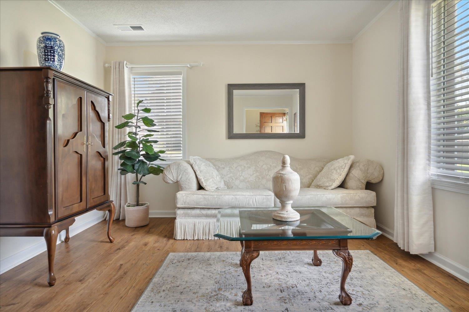 3274 Norton Road Memphis, TN 38109 - Photo 8 of 26 a living room with furniture potted plant and a window