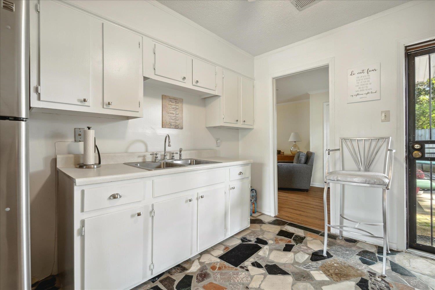 3274 Norton Road Memphis, TN 38109 - Photo 10 of 26 a kitchen with a sink and cabinets