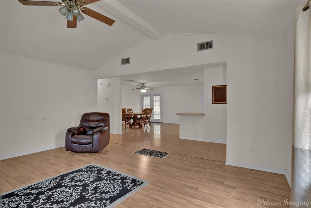 101 West Jefferson Street Haughton, LA 71037 - Photo 11 of 39 a room with lots of chairs and wooden floor