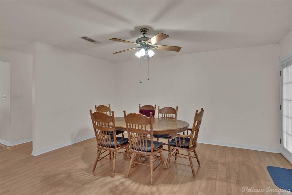 101 West Jefferson Street Haughton, LA 71037 - Photo 15 of 39 a view of a dining room with furniture and chandelier fan