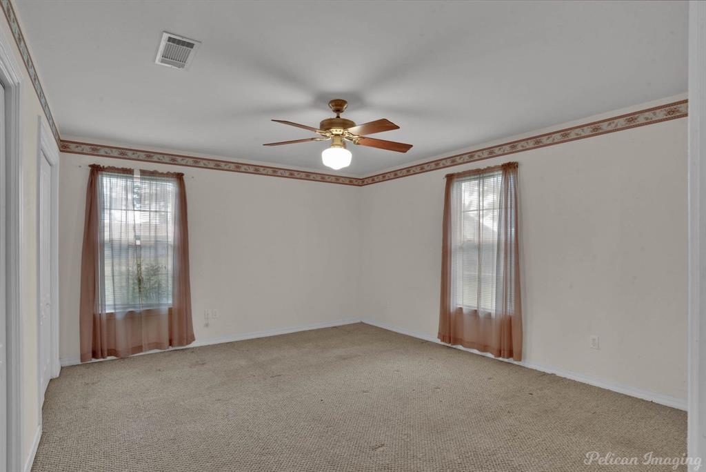 101 West Jefferson Street Haughton, LA 71037 - Photo 20 of 39 a view of an empty room with chandelier fan