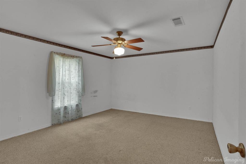 101 West Jefferson Street Haughton, LA 71037 - Photo 24 of 39 an empty room with windows and fan