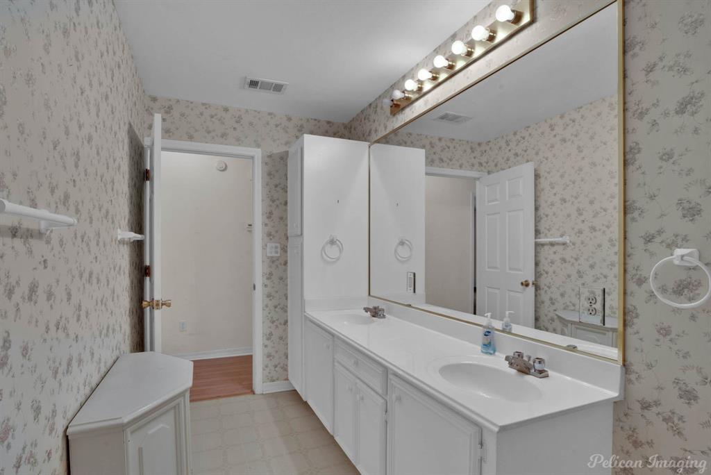 101 West Jefferson Street Haughton, LA 71037 - Photo 27 of 39 a bathroom with double vanity sink and a mirror