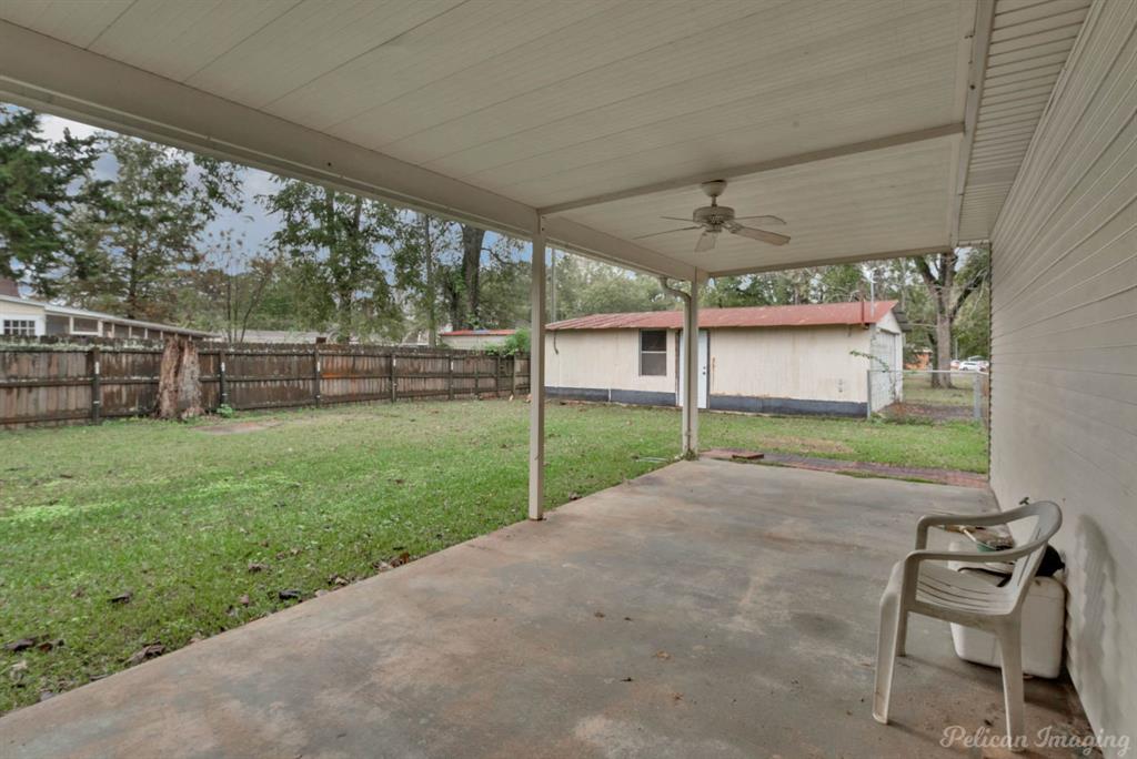 101 West Jefferson Street Haughton, LA 71037 - Photo 28 of 39 a view of a backyard with couches plants and large trees