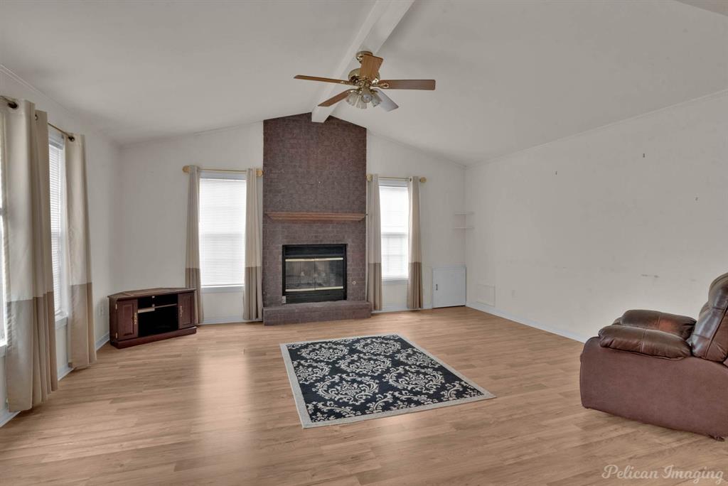 101 West Jefferson Street Haughton, LA 71037 - Photo 7 of 39 a living room with furniture and a fireplace