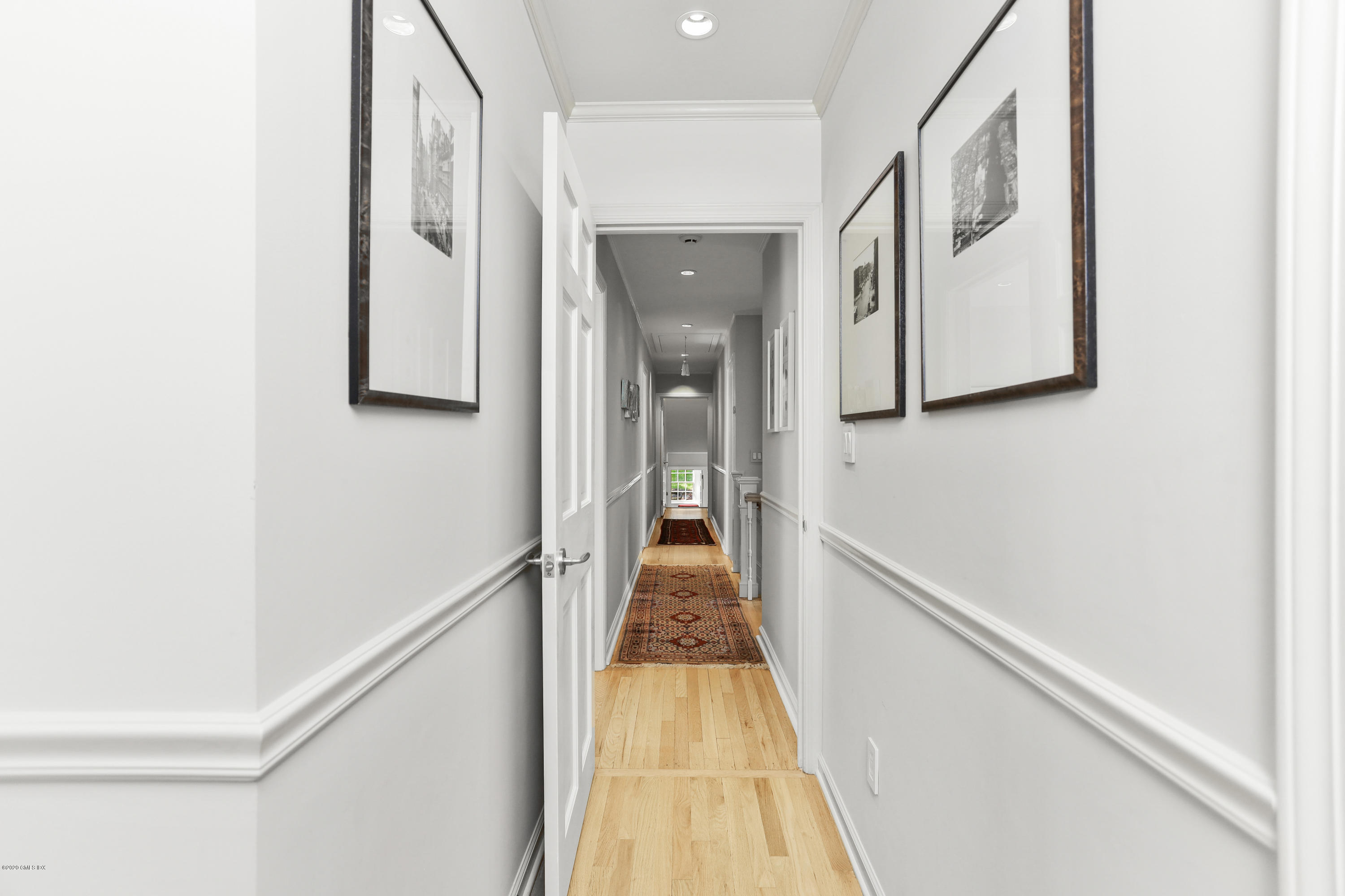 137 Clapboard Ridge Road Greenwich, CT 06831 - Photo 23 of 29 a view of a hallway with wooden floor and staircase