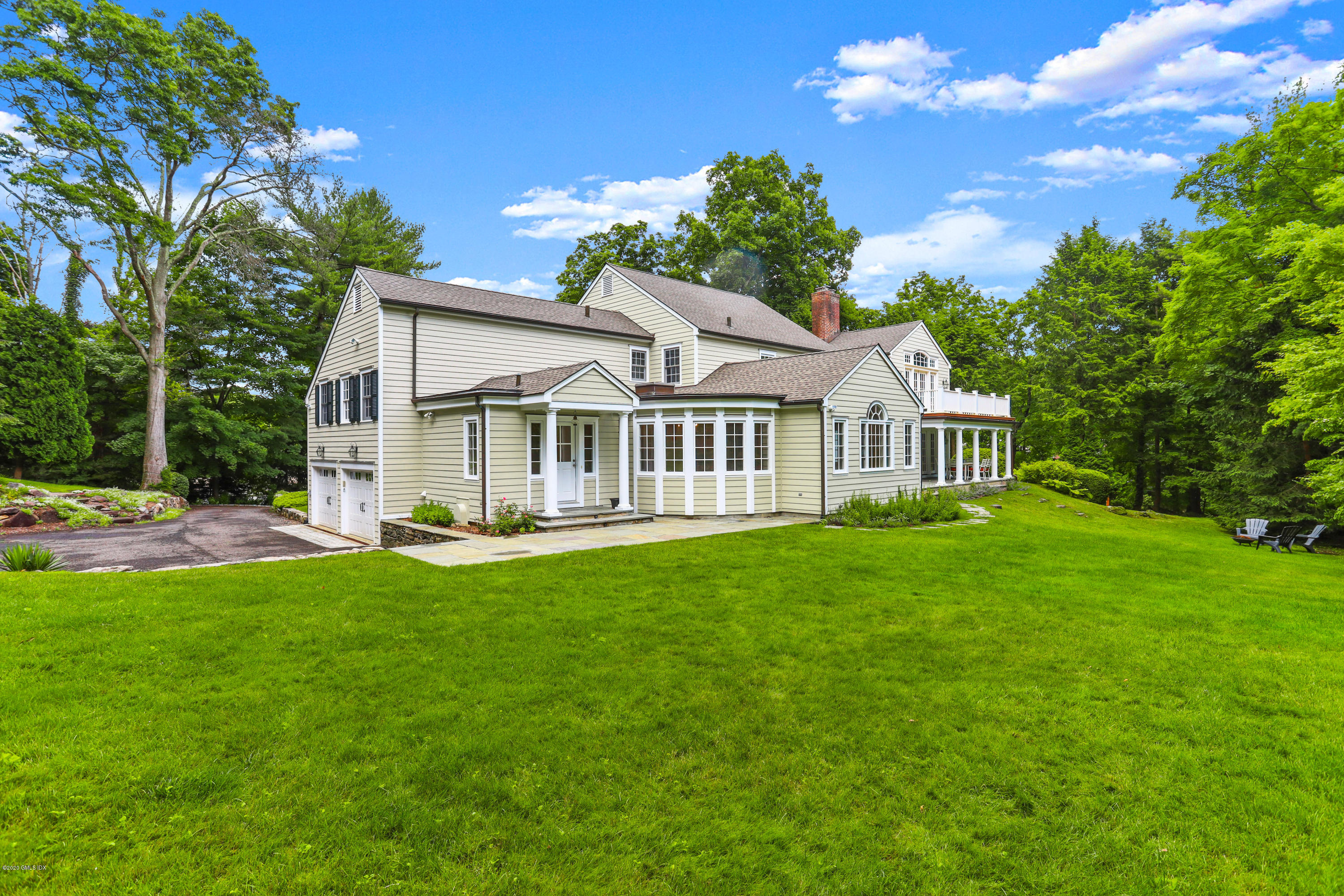 137 Clapboard Ridge Road Greenwich, CT 06831 - Photo 28 of 29 a view of a house with a garden
