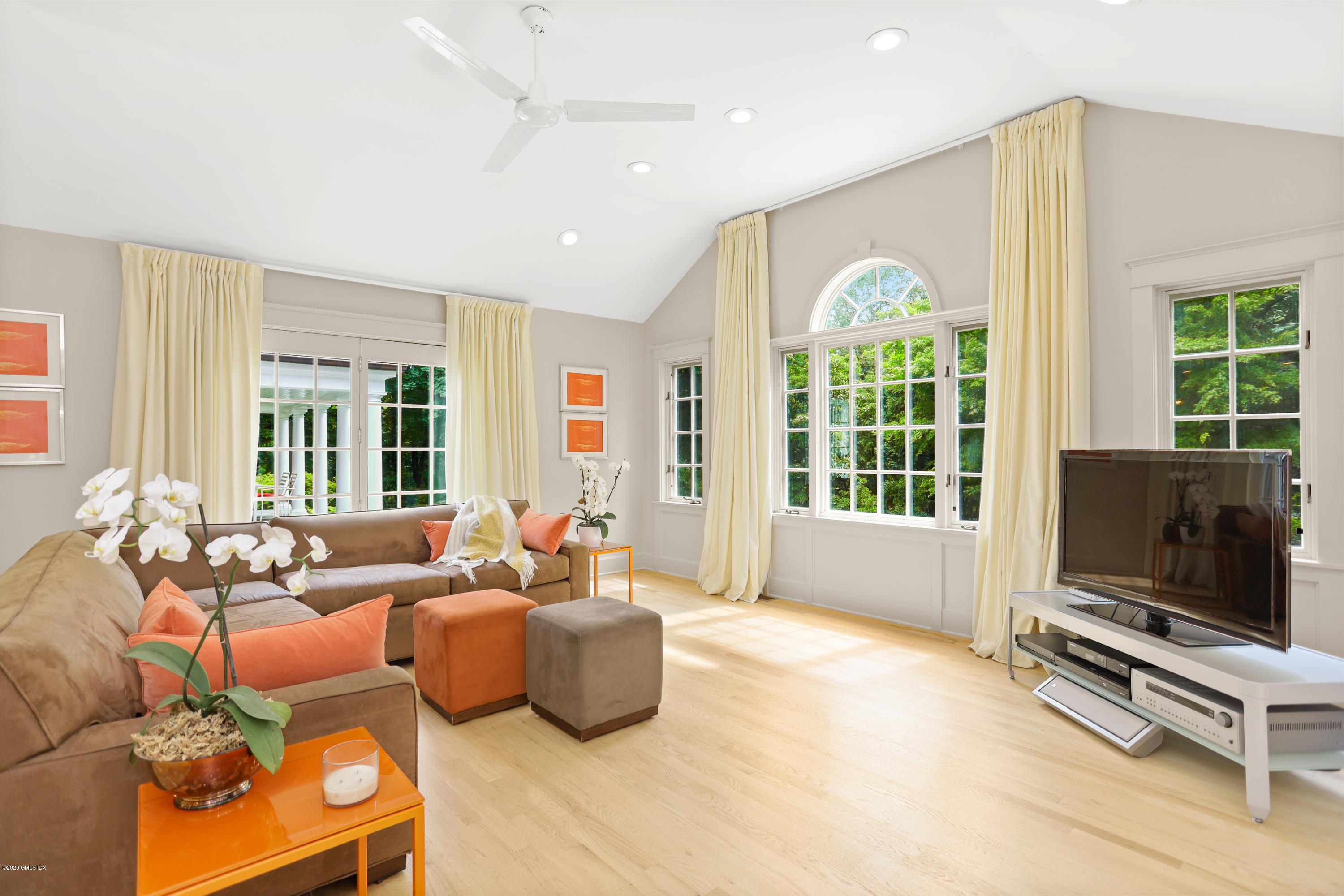 137 Clapboard Ridge Road Greenwich, CT 06831 - Photo 6 of 29 a living room with furniture a flat screen tv and a large window