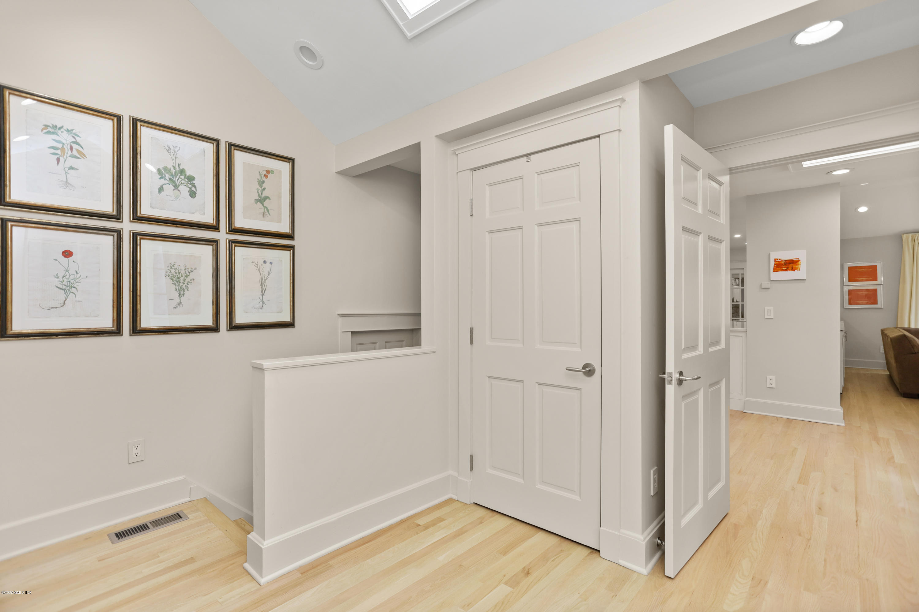 137 Clapboard Ridge Road Greenwich, CT 06831 - Photo 8 of 29 an empty room with wooden floor and windows