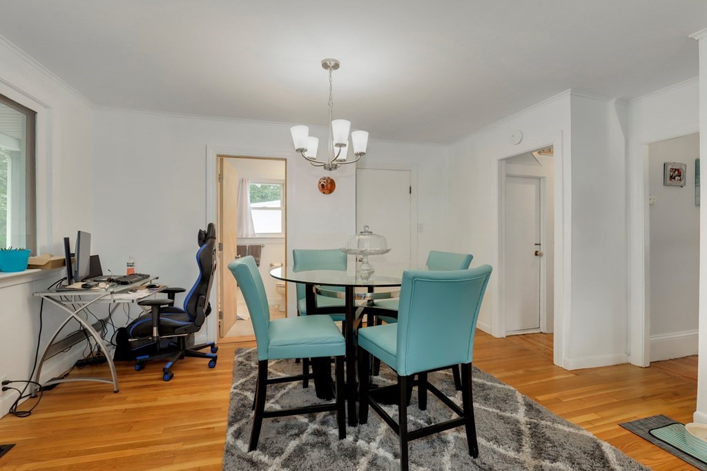 69 R Eastern Avenue Woburn, MA 01801 - Photo 20 of 35 a view of a dining room with furniture and wooden floor