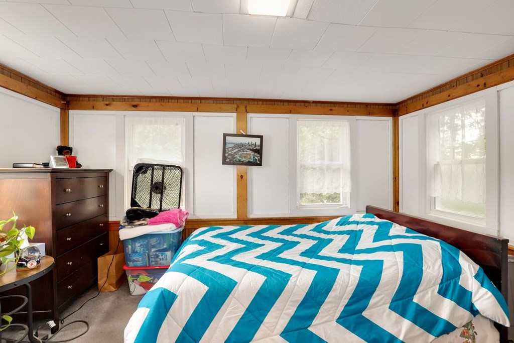 69 R Eastern Avenue Woburn, MA 01801 - Photo 24 of 35 a bedroom with a bed closet and a large window