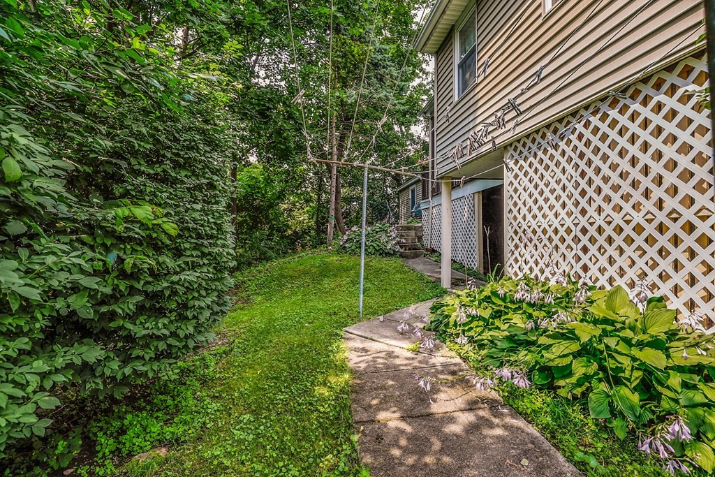 69 R Eastern Avenue Woburn, MA 01801 - Photo 31 of 35 a backyard of a house with lots of green space
