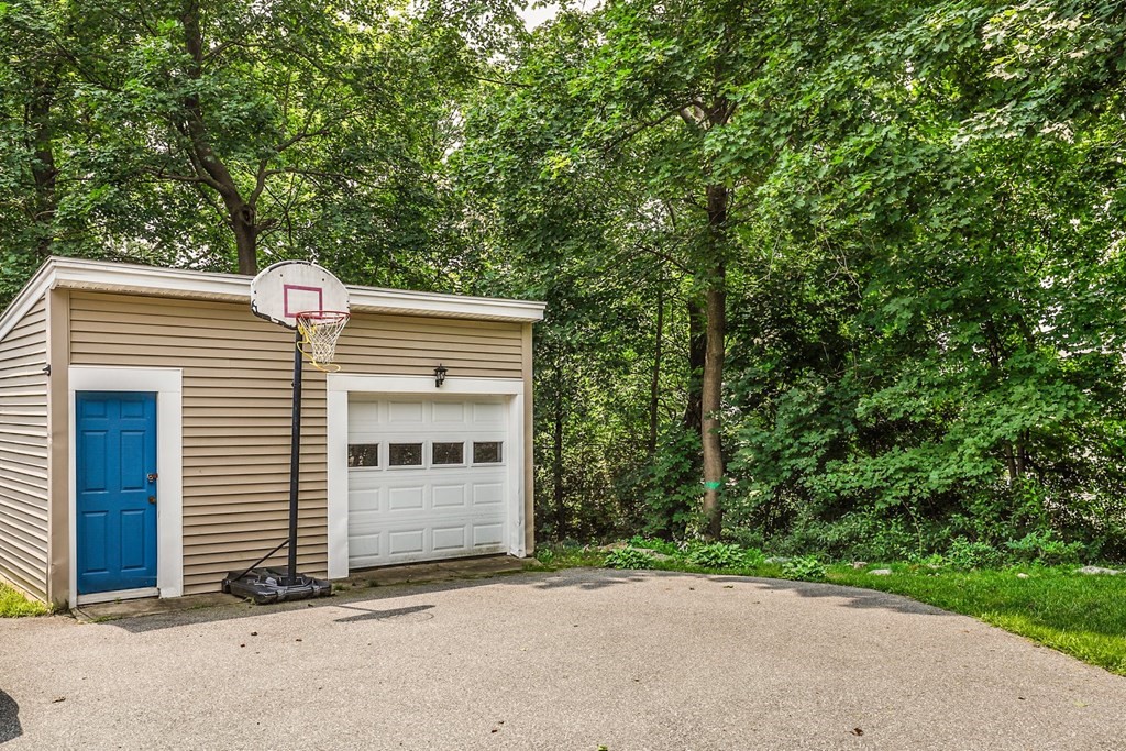 69 R Eastern Avenue Woburn, MA 01801 - Photo 33 of 35 a front view of a house with a garage