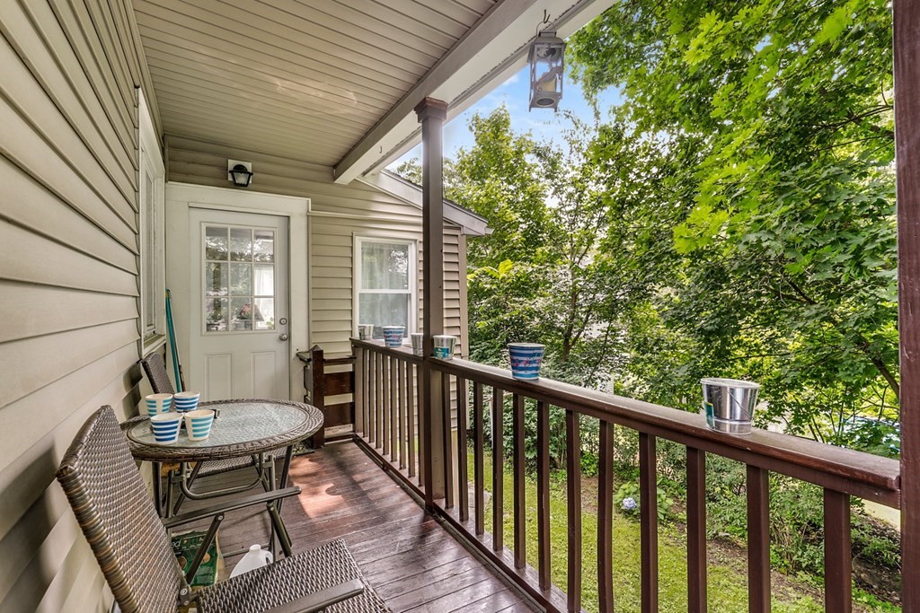 69 R Eastern Avenue Woburn, MA 01801 - Photo 34 of 35 a view of a balcony with chairs and a table