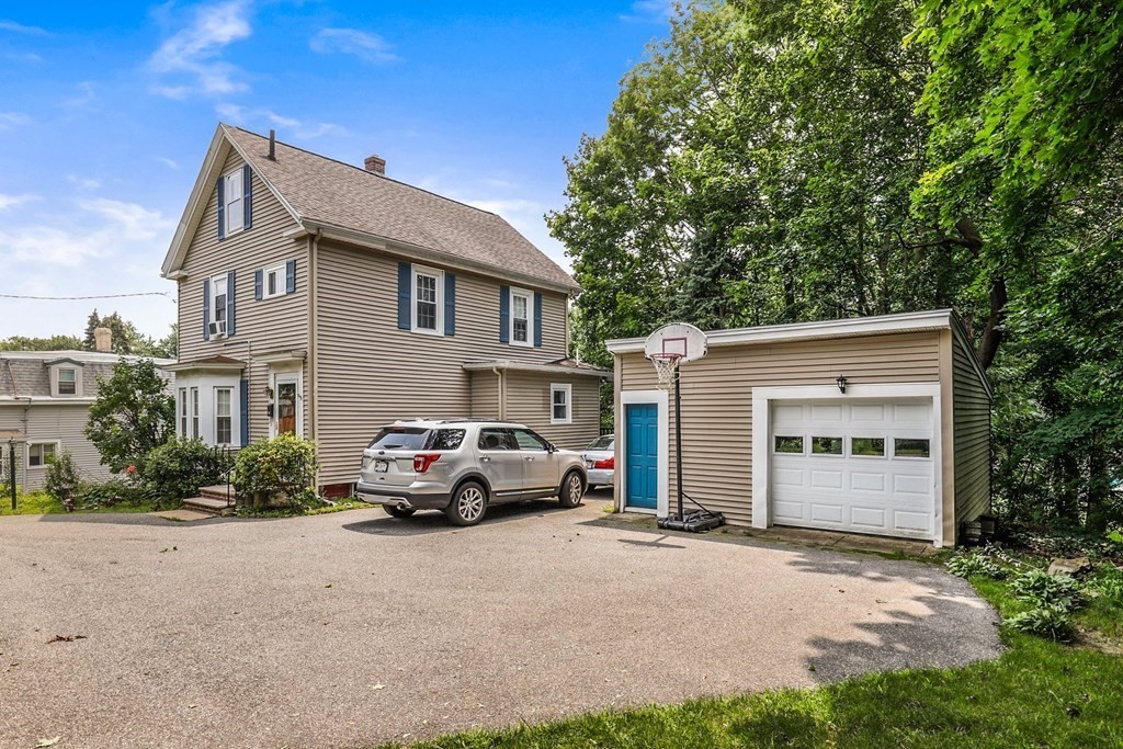 69 R Eastern Avenue Woburn, MA 01801 - Photo 5 of 35 a car parked in front of a house