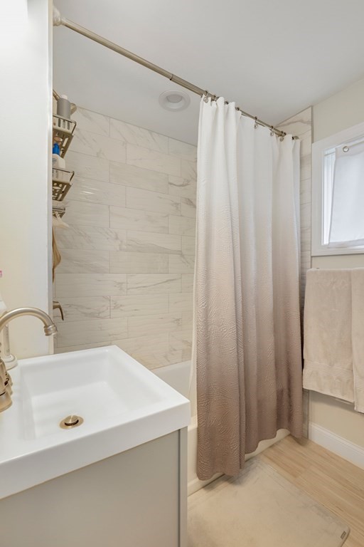 69 R Eastern Avenue Woburn, MA 01801 - Photo 7 of 35 a bathroom with a sink and a shower