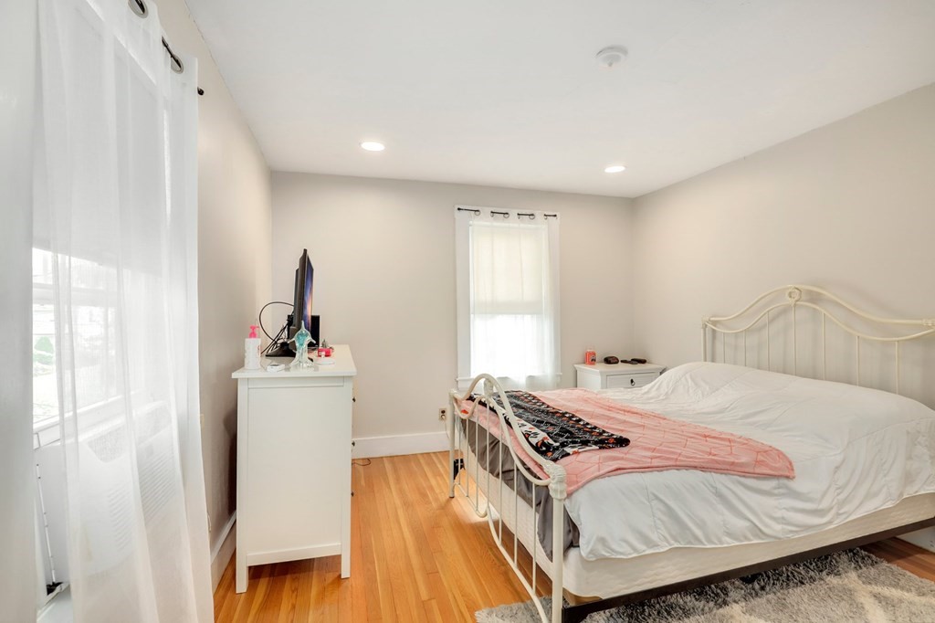 69 R Eastern Avenue Woburn, MA 01801 - Photo 9 of 35 a bedroom with a bed and wooden floor