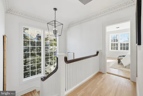 a bedroom with a bed and a fireplace