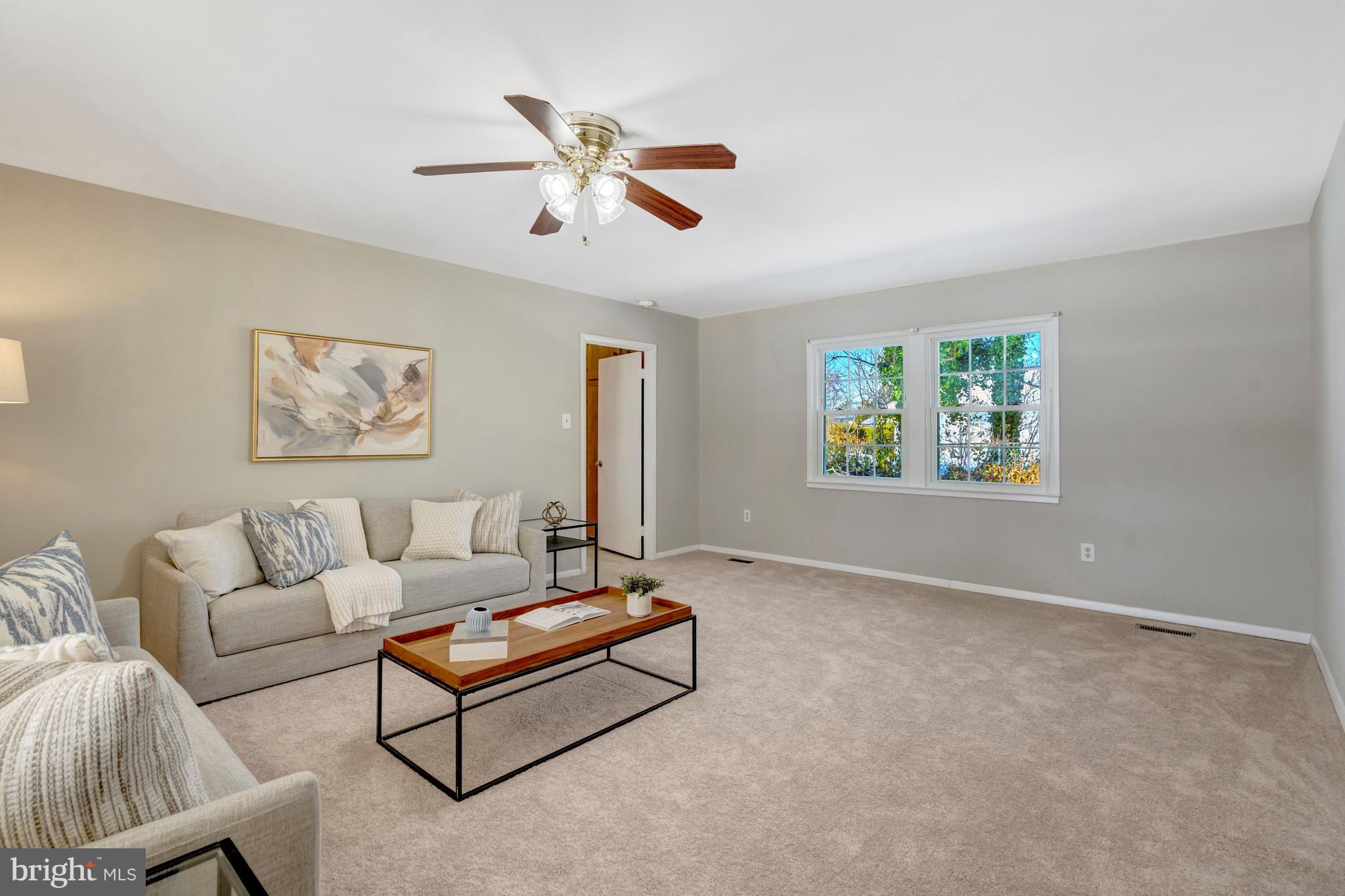 13128 Moss Ranch Lane Fairfax, VA 22033 - Photo 23 of 56 a living room with furniture and a large window