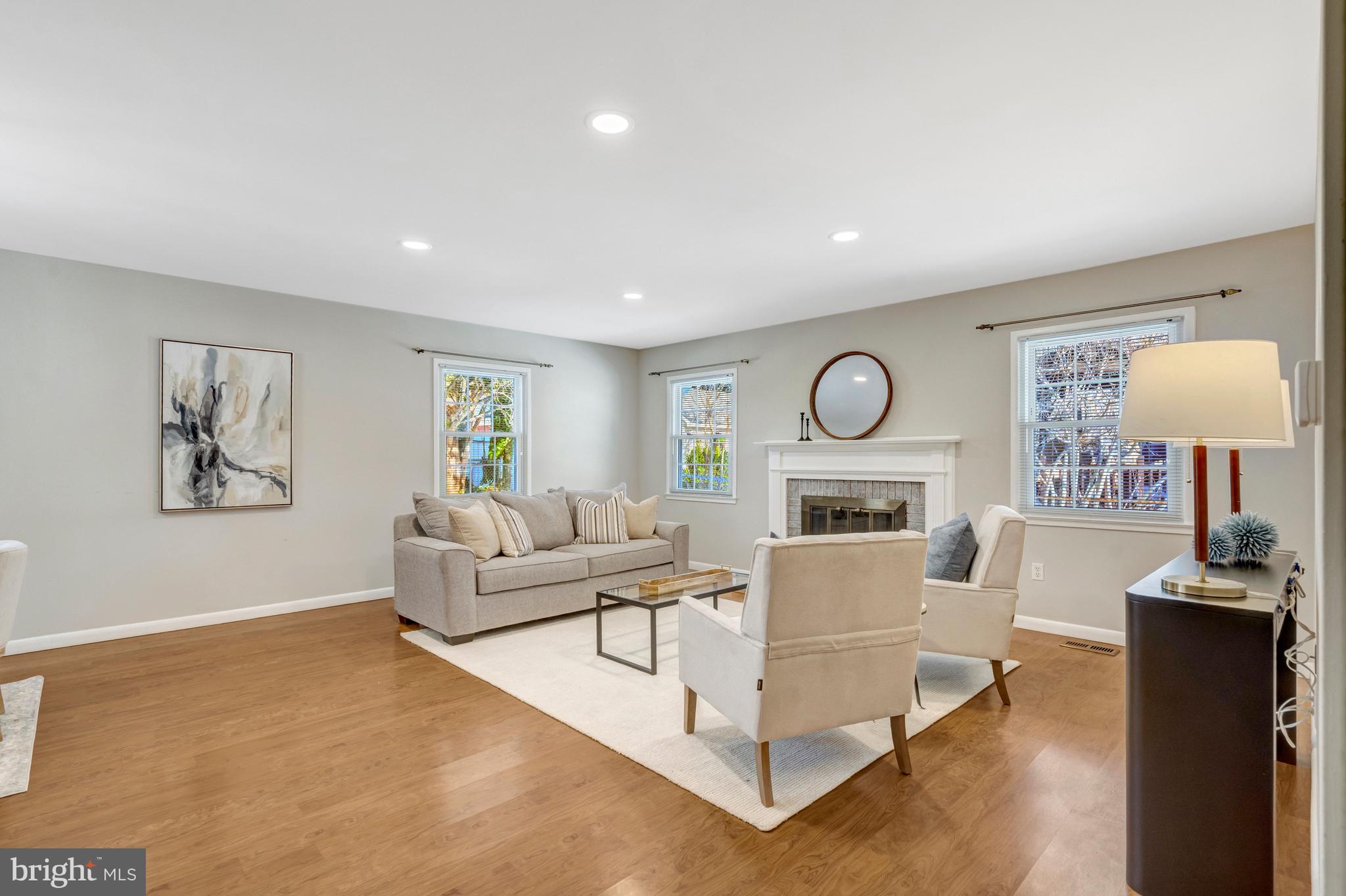13128 Moss Ranch Lane Fairfax, VA 22033 - Photo 24 of 56 a living room with furniture a lamp and a window