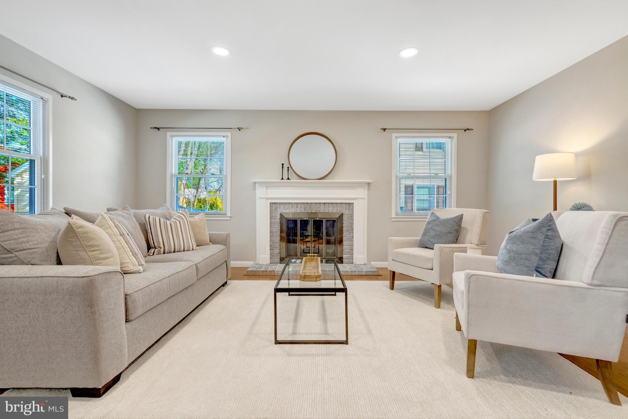 13128 Moss Ranch Lane Fairfax, VA 22033 - Photo 27 of 56 a living room with furniture and a fireplace