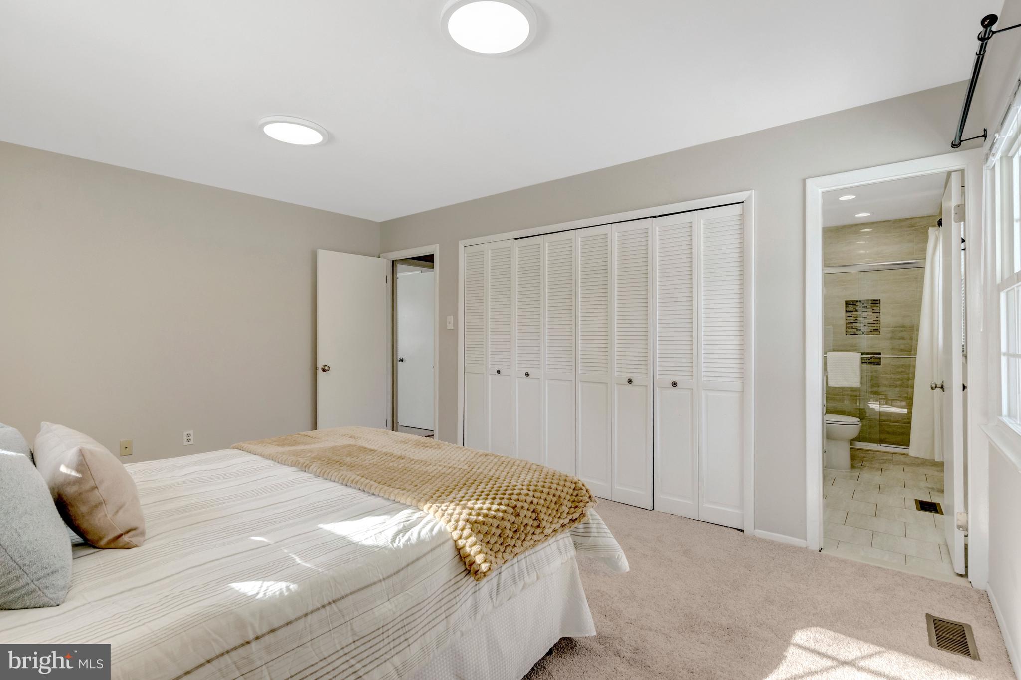 13128 Moss Ranch Lane Fairfax, VA 22033 - Photo 33 of 56 a bedroom with a bed and a shower