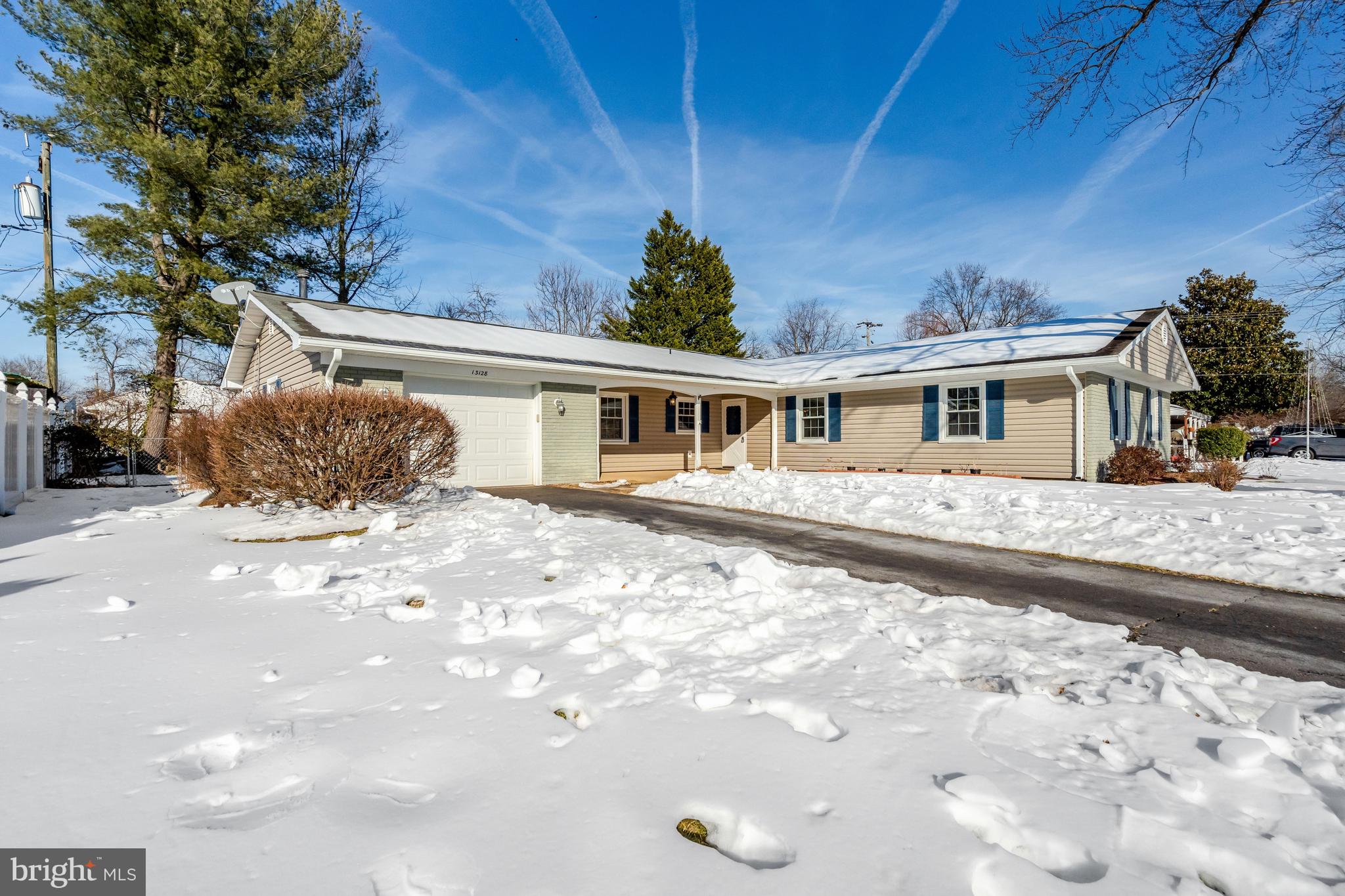 13128 Moss Ranch Lane Fairfax, VA 22033 - Photo 4 of 56 a front view of a house with a yard