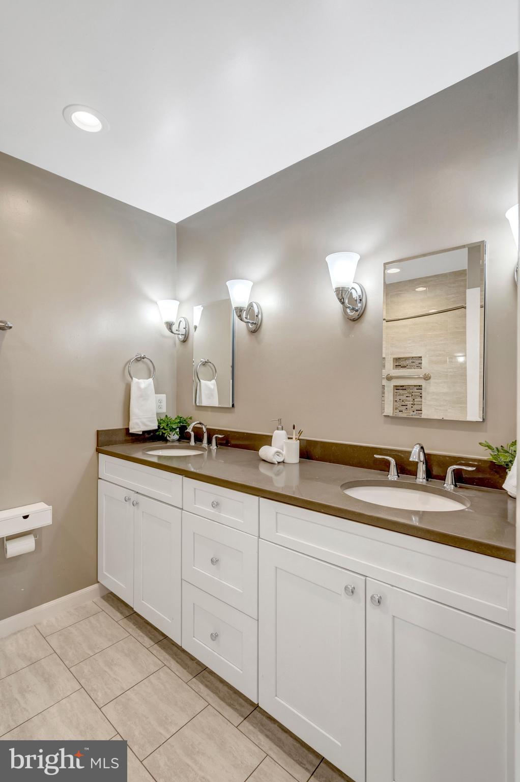 13128 Moss Ranch Lane Fairfax, VA 22033 - Photo 44 of 56 a bathroom with double sink and a mirror