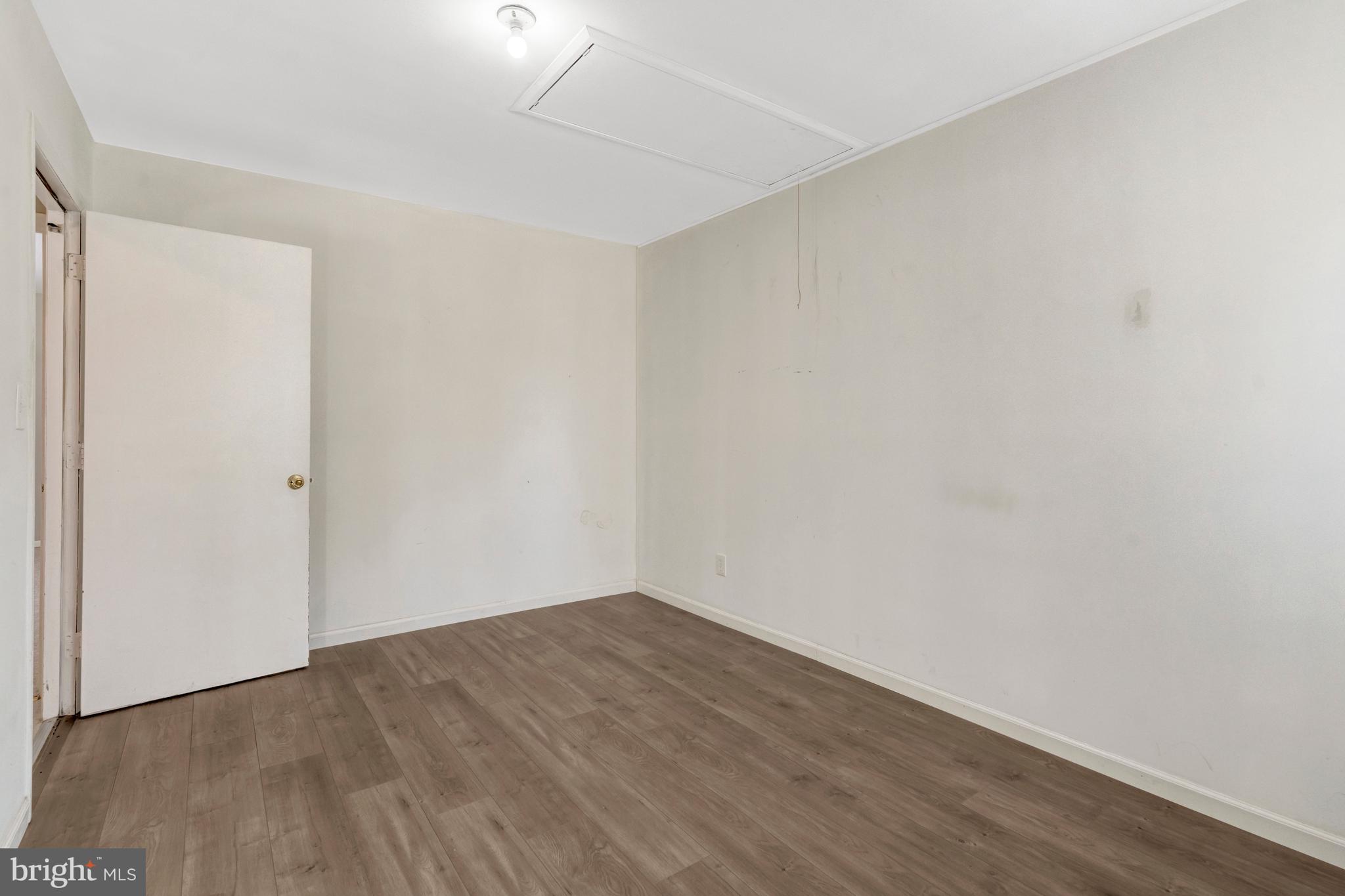 13128 Moss Ranch Lane Fairfax, VA 22033 - Photo 47 of 56 a view of an empty room with wooden floor