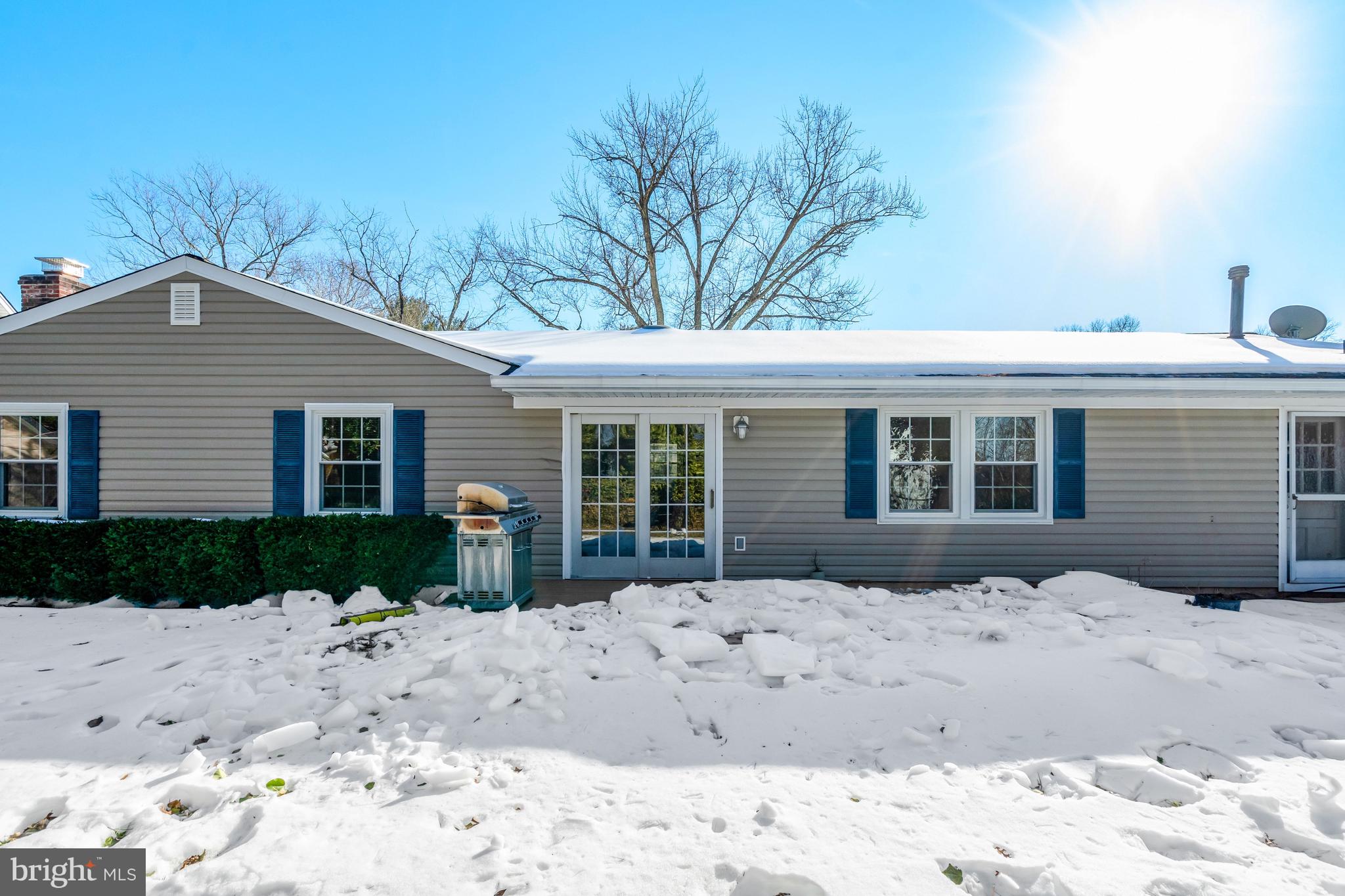 13128 Moss Ranch Lane Fairfax, VA 22033 - Photo 49 of 56 a front view of a house with a yard covered with snow