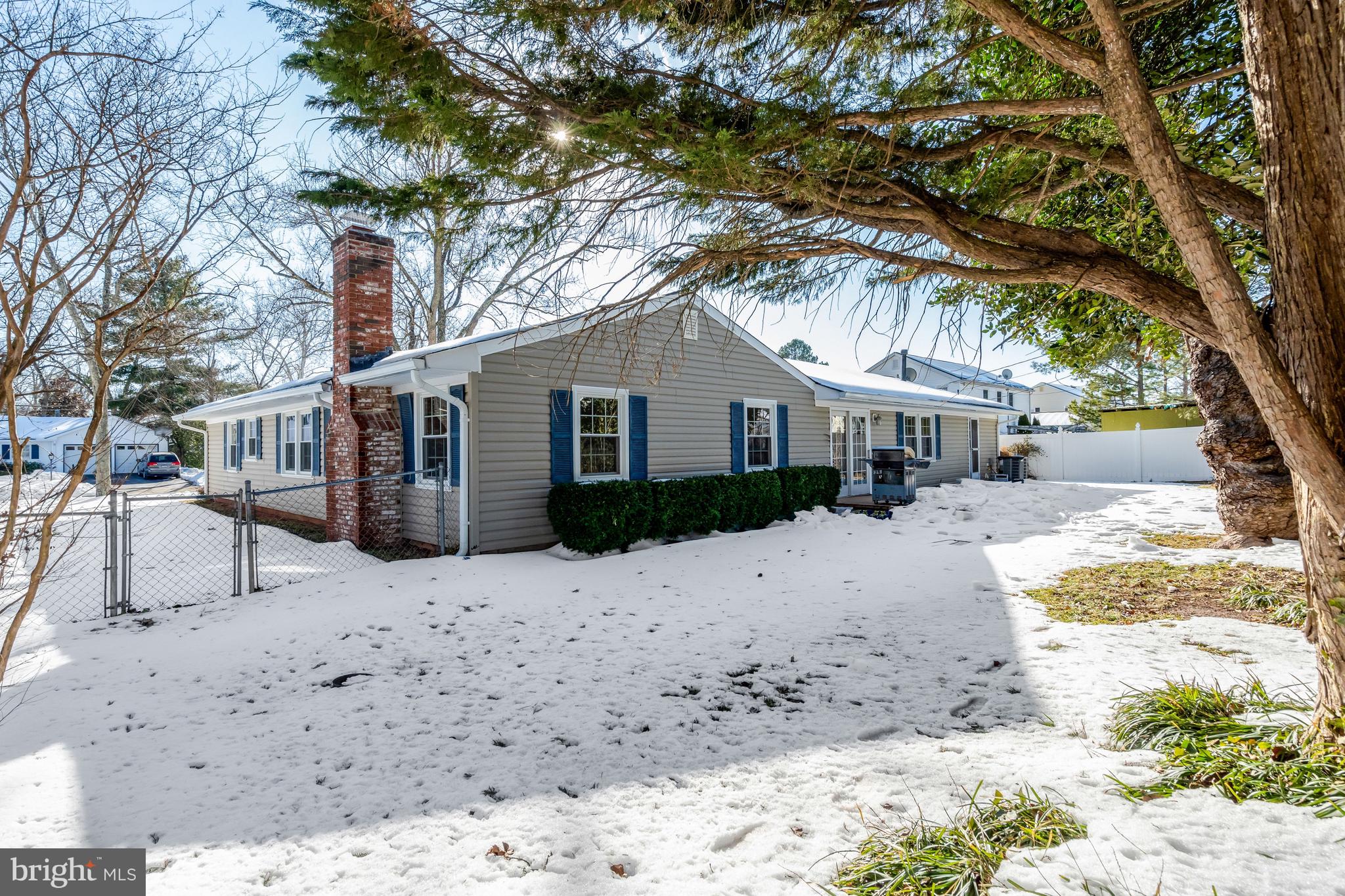 13128 Moss Ranch Lane Fairfax, VA 22033 - Photo 50 of 56 a white house that has a tree in front of it